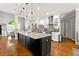 Bright kitchen featuring stainless steel appliances, granite counters, and hardwood flooring at 931 Windsor Creek Dr, Grayson, GA 30017