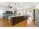 Spacious kitchen with stainless steel appliances, granite counters, and hardwood flooring at 931 Windsor Creek Dr, Grayson, GA 30017