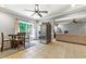 Open floor plan features tile floors, stainless refrigerator, dining area and adjacent comfortable living room at 931 Windsor Creek Dr, Grayson, GA 30017