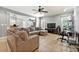 Spacious living room with tile floors, neutral paint, ceiling fan, and plenty of room for seating at 931 Windsor Creek Dr, Grayson, GA 30017