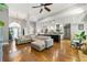 Open-concept living area with kitchen, dining, and living spaces featuring hardwood floors and neutral tones at 931 Windsor Creek Dr, Grayson, GA 30017