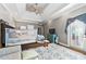 Spacious main bedroom featuring hardwood floors, a tray ceiling, and a private balcony entrance at 931 Windsor Creek Dr, Grayson, GA 30017