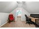 Office space with a desk and a red chair; a bedroom can be seen through the doorway at 931 Windsor Creek Dr, Grayson, GA 30017