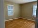 Neutral bedroom with hardwood flooring and natural lighting at 1053 Allgood Rd, Stone Mountain, GA 30083