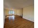 Bright living room with natural light, hardwood floors, and neutral paint at 1053 Allgood Rd, Stone Mountain, GA 30083