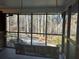Relaxing screened porch with swing overlooking the property at 1053 Allgood Rd, Stone Mountain, GA 30083