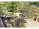 View of tiered wooded backyard with a shed and home in the background at 255 Shipp Cir, Hiram, GA 30141