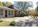 Exterior view of home with long driveway and covered front porch, beautiful yard at 255 Shipp Cir, Hiram, GA 30141