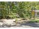 The property has mature trees surrounding the home and a driveway leading to the entrance at 255 Shipp Cir, Hiram, GA 30141