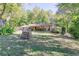 Charming front yard featuring a bench, well-maintained lawn and rocking chair front porch at 255 Shipp Cir, Hiram, GA 30141