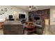 Comfortable living room featuring a brick fireplace, and open windows at 255 Shipp Cir, Hiram, GA 30141