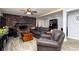 Spacious living room with brick fireplace, wood floors and comfortable seating at 255 Shipp Cir, Hiram, GA 30141