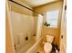 This bathroom includes a white shower and toilet and a plant in the window at 2579 Wimberley Pine Ct, Dacula, GA 30019