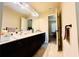 A bathroom featuring double sinks with a white countertop at 2579 Wimberley Pine Ct, Dacula, GA 30019