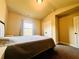This bedroom features neutral walls, carpet, and ample natural light at 2579 Wimberley Pine Ct, Dacula, GA 30019