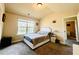 This bedroom features neutral walls, carpet, and ample natural light at 2579 Wimberley Pine Ct, Dacula, GA 30019