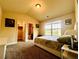 This bedroom features neutral walls, carpet, and a view to an ensuite bathroom at 2579 Wimberley Pine Ct, Dacula, GA 30019