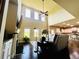Spacious living room with high ceilings, large windows, and a fireplace creating a bright and airy atmosphere at 2579 Wimberley Pine Ct, Dacula, GA 30019