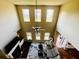 Living room with soaring ceilings, ample windows, cozy fireplace, and open floor plan at 2579 Wimberley Pine Ct, Dacula, GA 30019