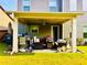 Covered patio area with comfortable seating, ideal for outdoor dining and relaxation at 2579 Wimberley Pine Ct, Dacula, GA 30019