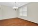 Spacious dining room with hardwood floors and a chandelier at 3485 Walnut Rdg, Atlanta, GA 30349