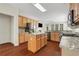 Bright kitchen featuring a granite island, stainless appliances, wood cabinets and hardwood floors at 3485 Walnut Rdg, Atlanta, GA 30349