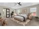 Serene main bedroom with tray ceiling, plush carpet, and abundant natural light at 3485 Walnut Rdg, Atlanta, GA 30349