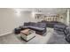 Finished basement with plush seating and ample space for relaxation, perfect for Gathering movie nights or entertaining guests at 3715 Borning Ct, Johns Creek, GA 30022