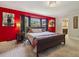 Bright primary bedroom with a bay window and view to the backyard at 3715 Borning Ct, Johns Creek, GA 30022