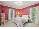 Cozy bedroom with two windows, white bedding, and floral curtains at 3715 Borning Ct, Johns Creek, GA 30022