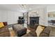 Cozy living room features a fireplace, dark trim, and ample seating for guests and Gathering at 3715 Borning Ct, Johns Creek, GA 30022