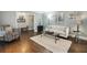 Bright living room featuring hardwood floors, natural light, and stylish furniture at 3715 Borning Ct, Johns Creek, GA 30022