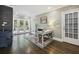 Office with brick accent wall, stylish desk, and French doors leading to the outside at 3715 Borning Ct, Johns Creek, GA 30022