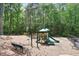Community playground surrounded by trees featuring slides and climbing structures at 3715 Borning Ct, Johns Creek, GA 30022