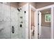 Modern bathroom featuring a glass-enclosed shower with marble tile at 129 Henley St, Canton, GA 30114