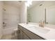 Bathroom featuring a double sink, white countertops, neutral-toned walls, and a tub with shower at 129 Henley St, Canton, GA 30114