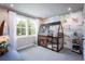 Fun bedroom featuring a log cabin style bunk bed and decorative camping themed wall art at 129 Henley St, Canton, GA 30114