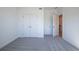 Bedroom with closet and view to hallway, showing carpet and white trim at 129 Henley St, Canton, GA 30114