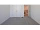 Bedroom with closet and view to stairway, showing carpet and white trim at 129 Henley St, Canton, GA 30114
