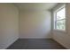 Bright bedroom with a large window offering natural light and a view of the outside at 129 Henley St, Canton, GA 30114