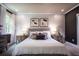Well-lit bedroom with white comforter, accent pillows and modern decor at 129 Henley St, Canton, GA 30114
