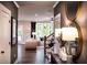 Stylish entryway with elegant decor, featuring a view into the living room and staircase at 129 Henley St, Canton, GA 30114