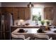 Well-lit kitchen with stainless steel appliances, bright cabinets, and a breakfast bar at 129 Henley St, Canton, GA 30114