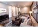 Modern living room features hardwood floors, a comfortable sectional sofa, and a stylish coffee table at 129 Henley St, Canton, GA 30114