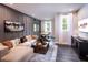 Entertaining game room with comfortable seating, a pool table, and a large-screen television at 129 Henley St, Canton, GA 30114