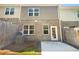Backyard with a concrete patio and partial fence at 1958 Millstream Holw, Conyers, GA 30012