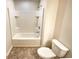 Clean bathroom with a shower-tub combo and a white toilet at 1958 Millstream Holw, Conyers, GA 30012