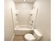 Bathroom featuring a shower-tub combo, and a toilet at 1958 Millstream Holw, Conyers, GA 30012