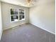 Cozy bedroom with soft carpet and a view of the neighborhood at 1958 Millstream Holw, Conyers, GA 30012