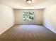 Unfurnished bedroom featuring natural lighting and neutral-toned carpet at 1958 Millstream Holw, Conyers, GA 30012